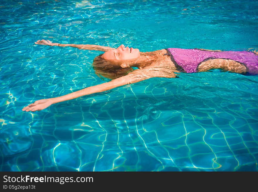 Young woman in the pool. Young woman in the pool