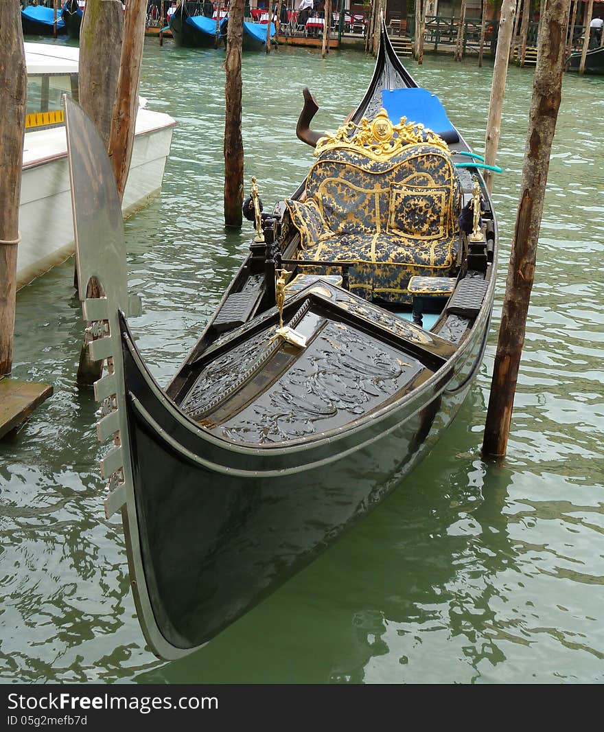 Venice - a detailed view of a gondola on the Canal Grande. Venice - a detailed view of a gondola on the Canal Grande