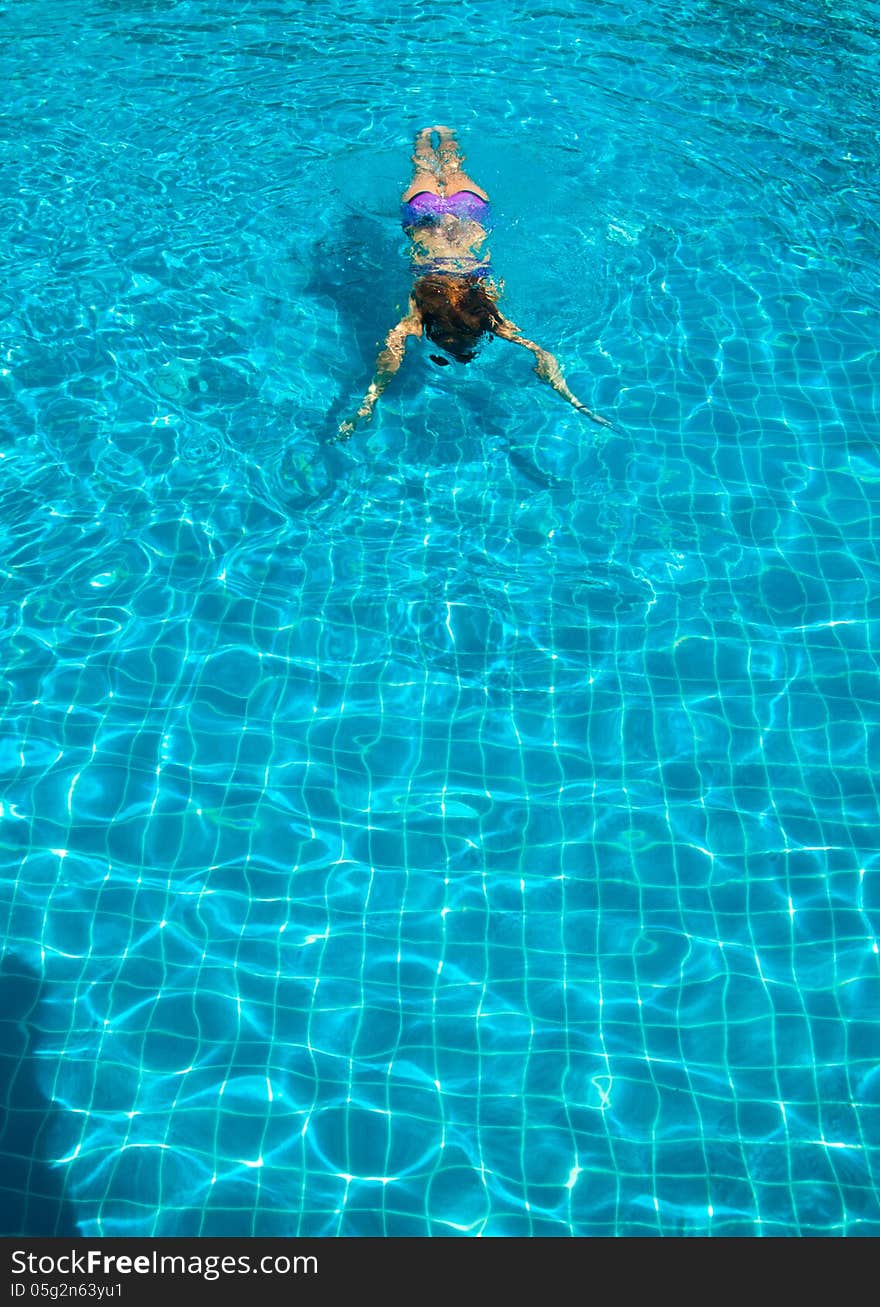 Young woman in the pool. Young woman in the pool