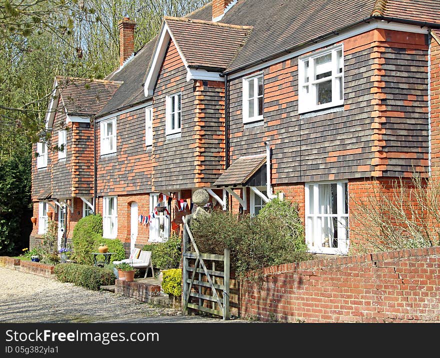 Photo of red brick rural kent cottages located in the tranquil village of harbledown. photo taken 1st may 2013.