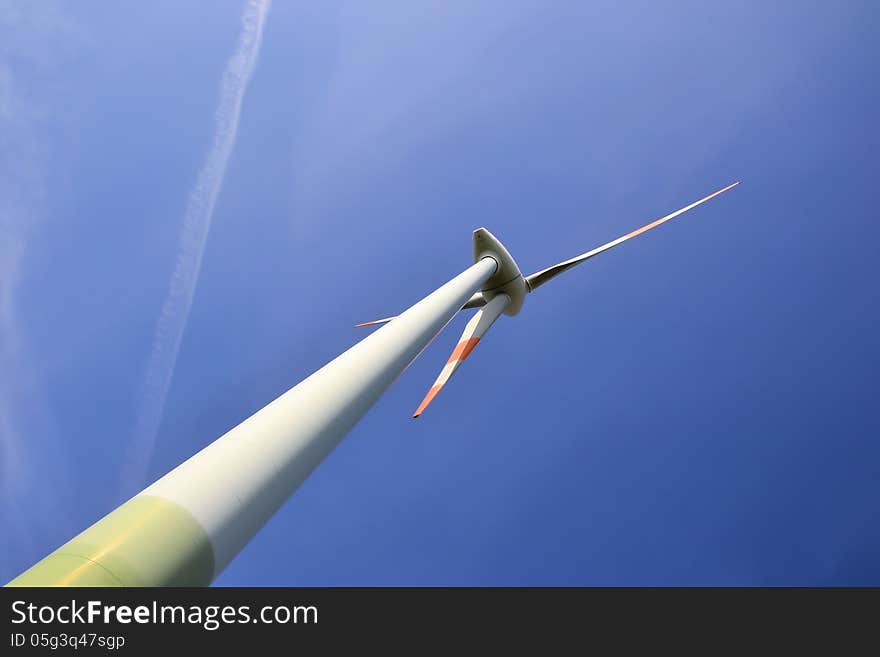 Close-up of a wind turbine and blue sky