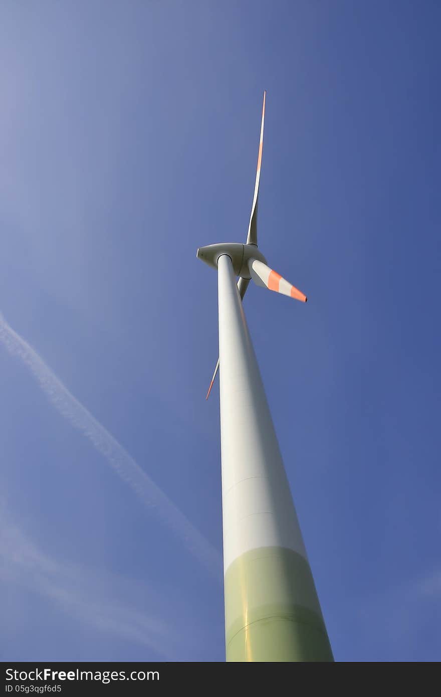 Close-up of a wind turbine and blue sky