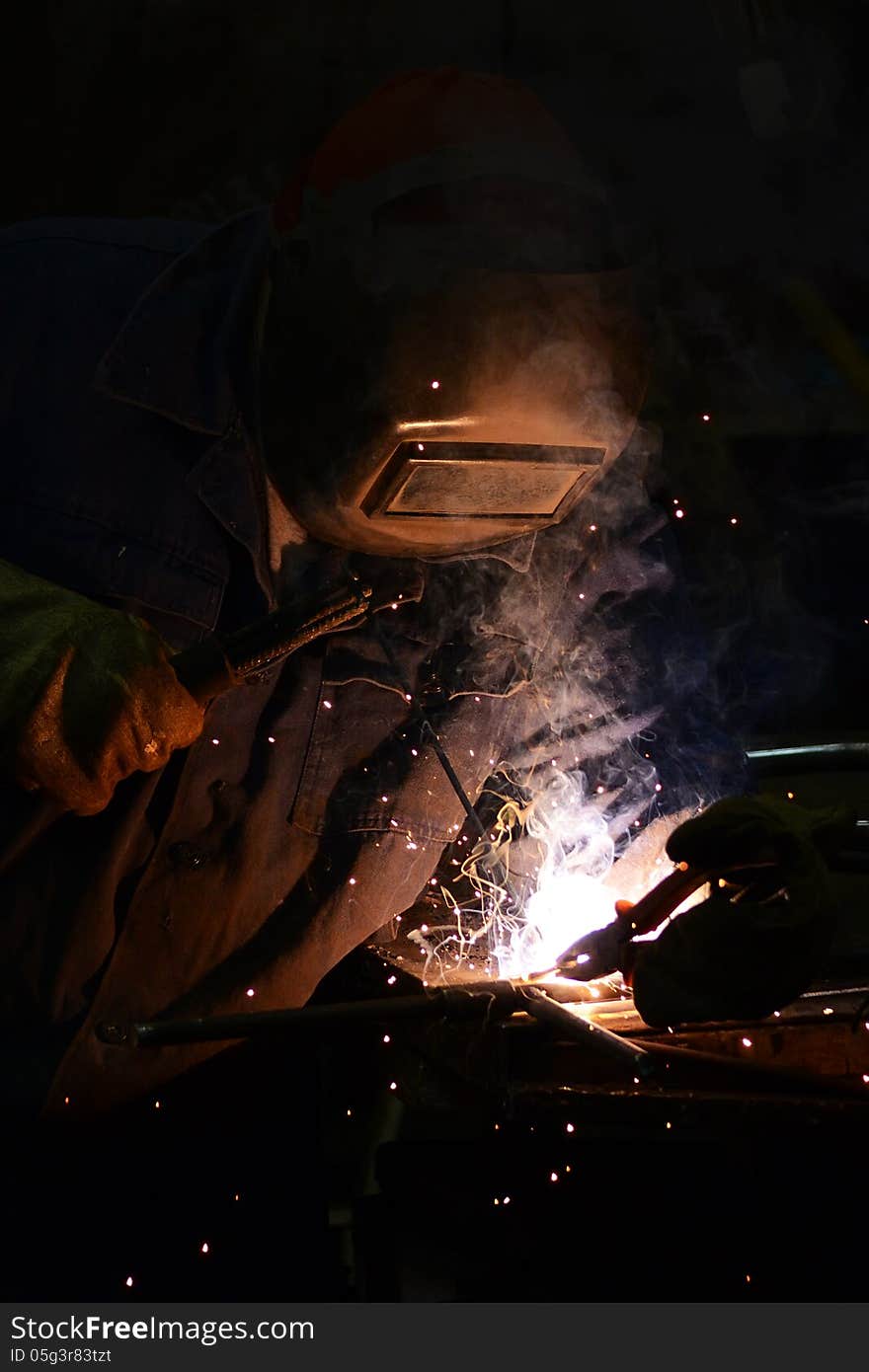 Electric welder at work.