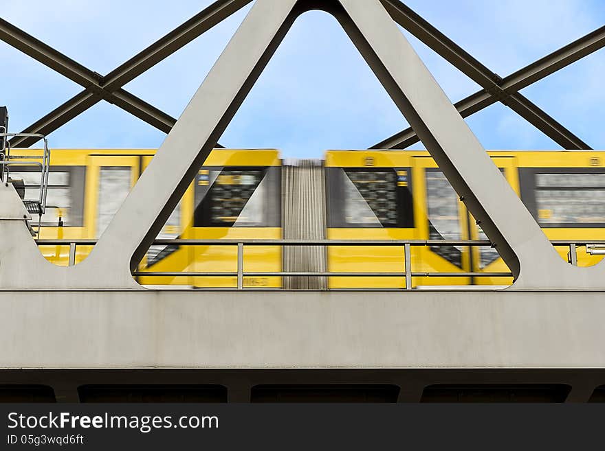 Yellow Moving Tram On A Bridge In Berlin