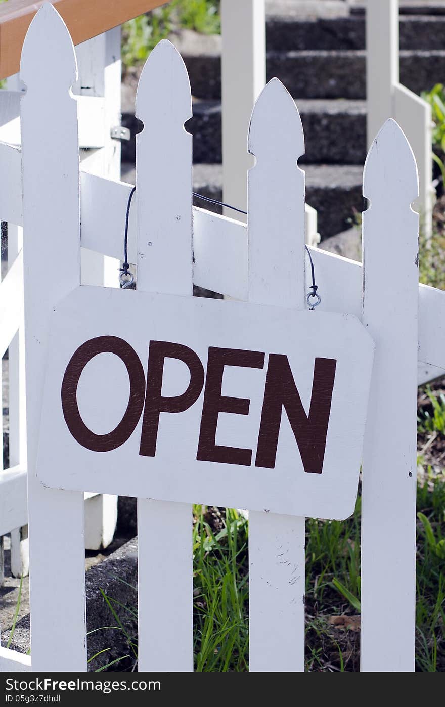 An open sign hanged outside a restaurant, store, office or other business (copy-space available for design)