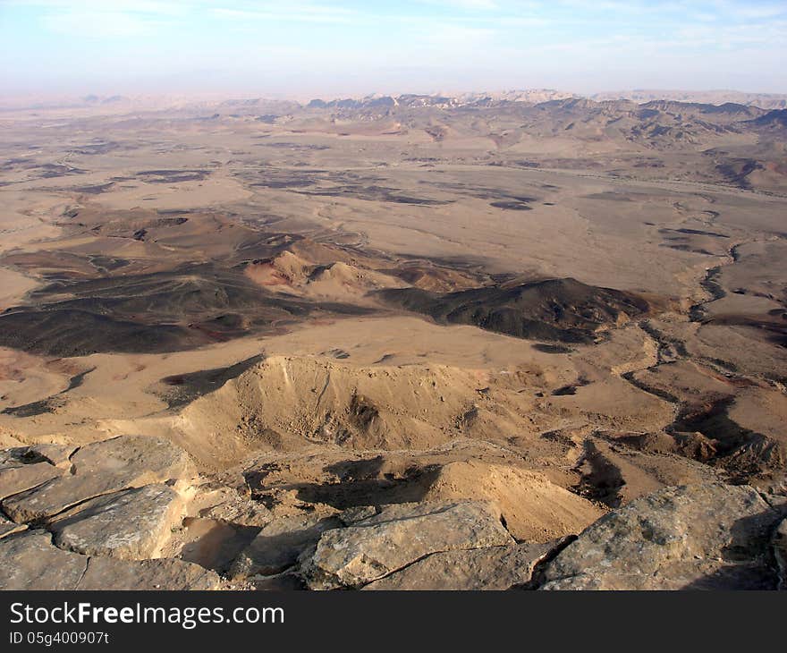 Aerial view of Ramon Crater - Makhtesh Ramon in the Negev Desert at the south region of Israel. Aerial view of Ramon Crater - Makhtesh Ramon in the Negev Desert at the south region of Israel.