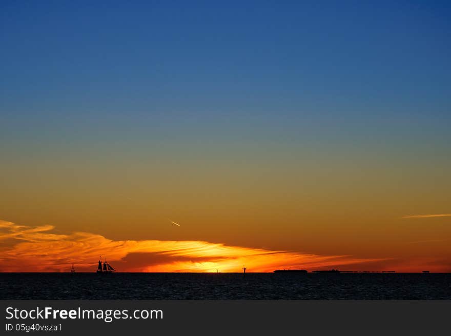 Silhouette of a Sailboat during a beautiful Sunset. Silhouette of a Sailboat during a beautiful Sunset