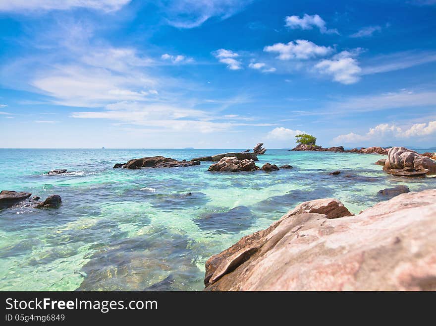 Sea coast with stones and blue sky. Sea coast with stones and blue sky