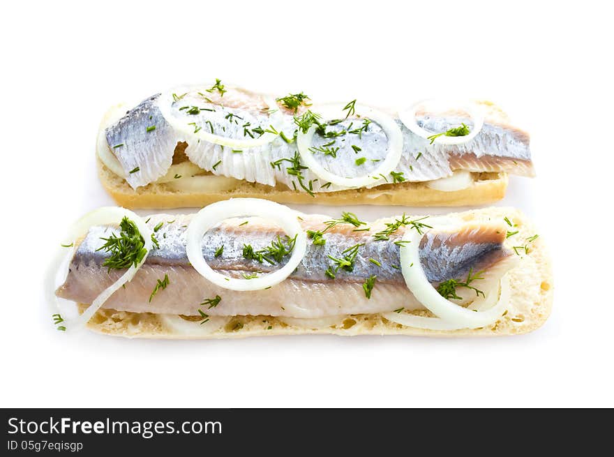 Sandwiches with herring, onions and herbs, isolated