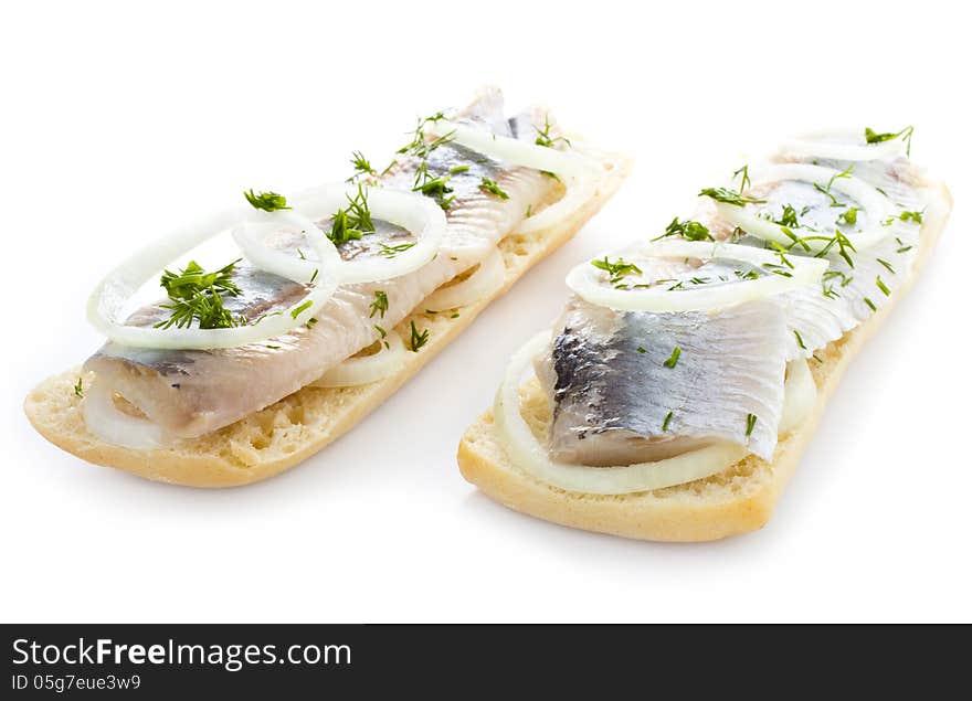 Sandwiches with herring, onions and herbs, isolated