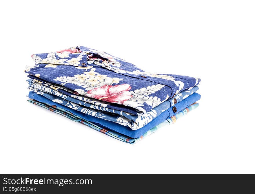 Stack of colorful men's shirts isolated on white. Stack of colorful men's shirts isolated on white.