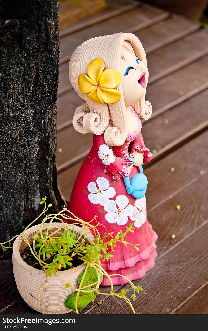 Girl clay dolls in garden. Girl clay dolls in garden