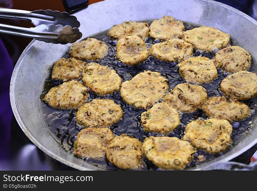 Fried fish in frying pan