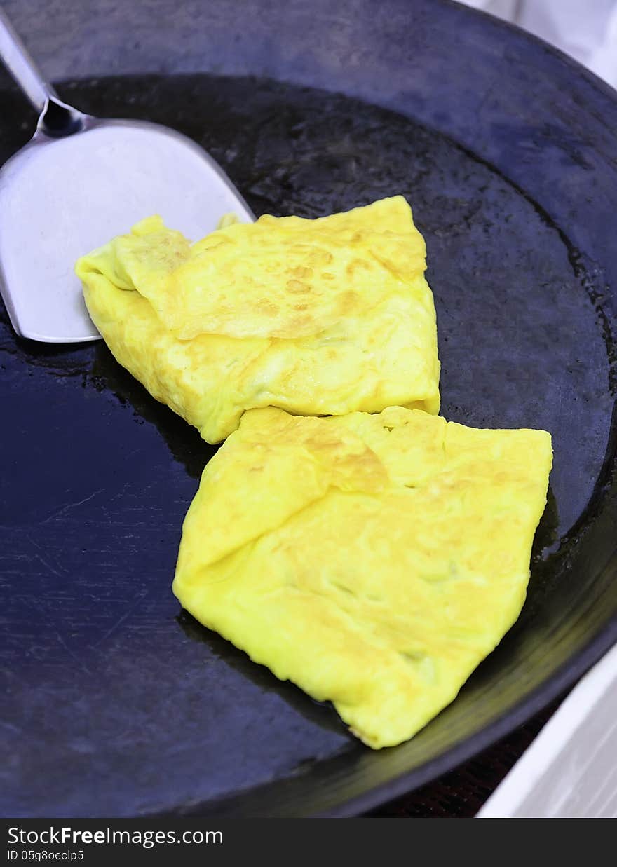 Omelette in the pan at restaurant