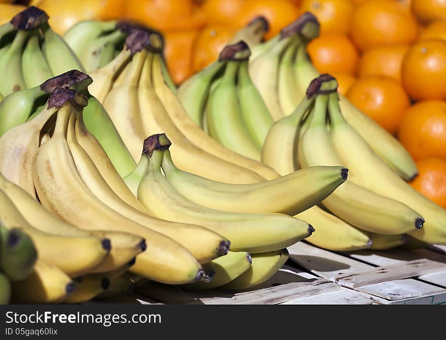 Fruit market with green-yellow bananas