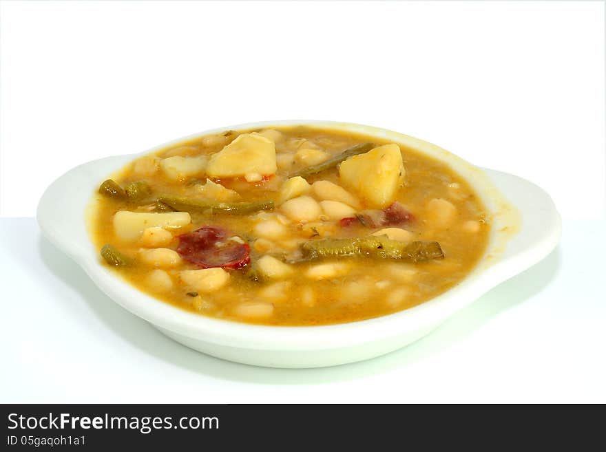 Bean stew with potatoes, pepper and a kind of asparagus. Bean stew with potatoes, pepper and a kind of asparagus