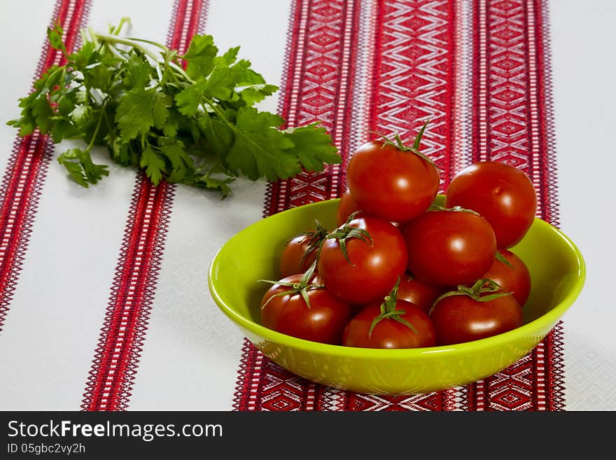 Tomatoes In A Green Bowl And Parsley