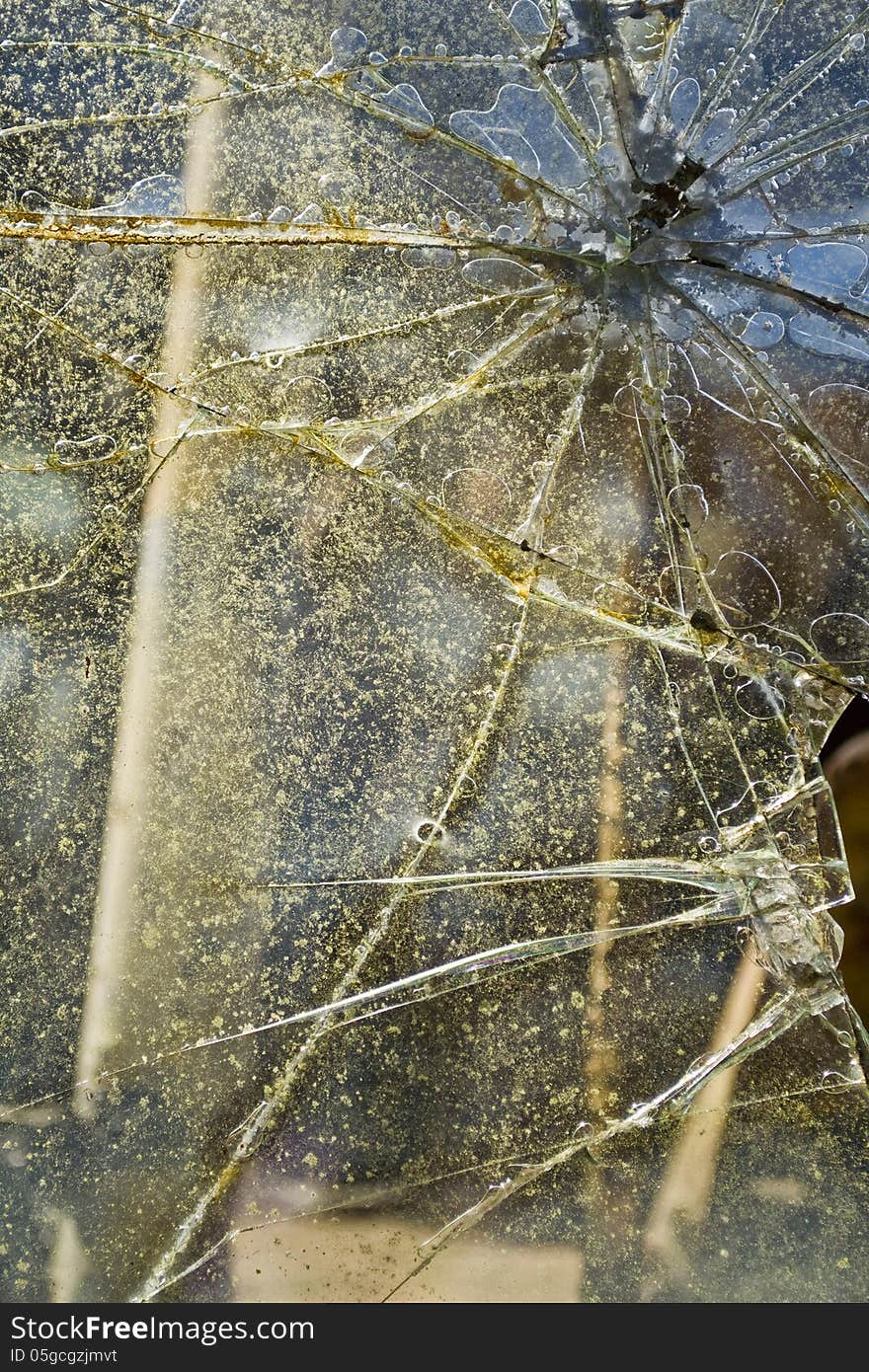 Closeup detail of old broken glass.