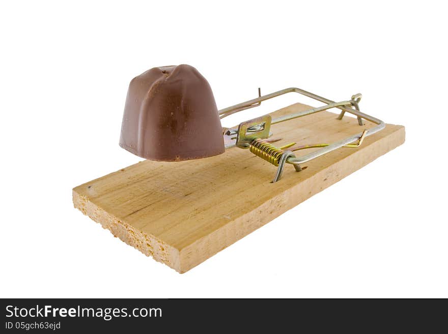 Conceptual image of chocolate on a mousetrap. Conceptual image of chocolate on a mousetrap.