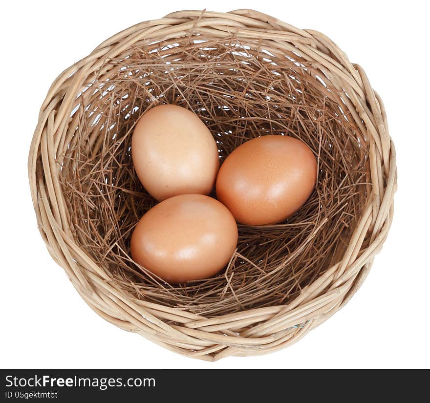 Egg in basket isolated on white background. Egg in basket isolated on white background