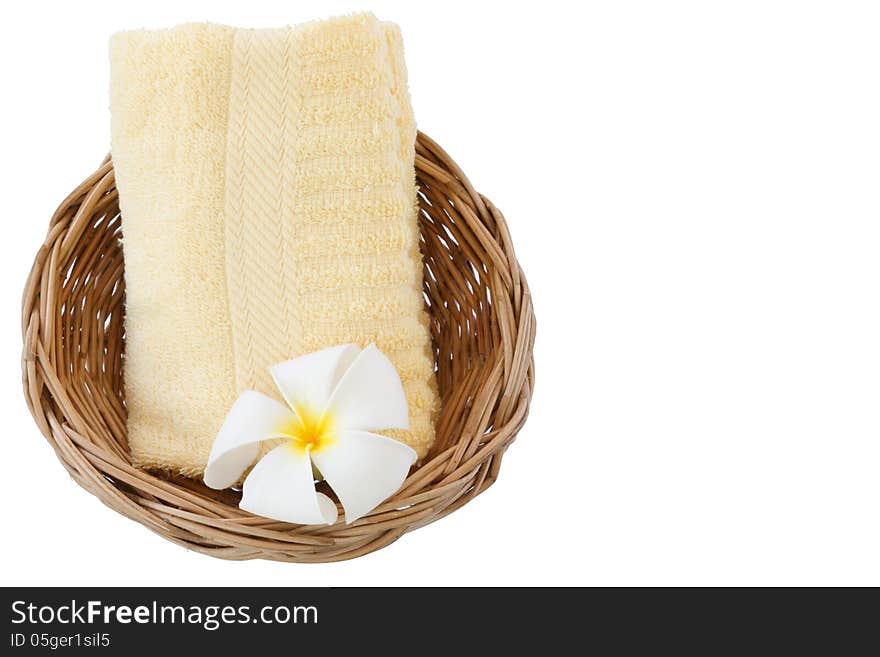 Towel in basket isolated on white background.