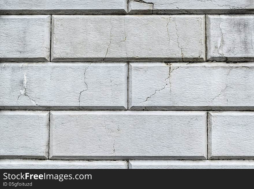 Old white wall of stone blocks in retro style. Old white wall of stone blocks in retro style