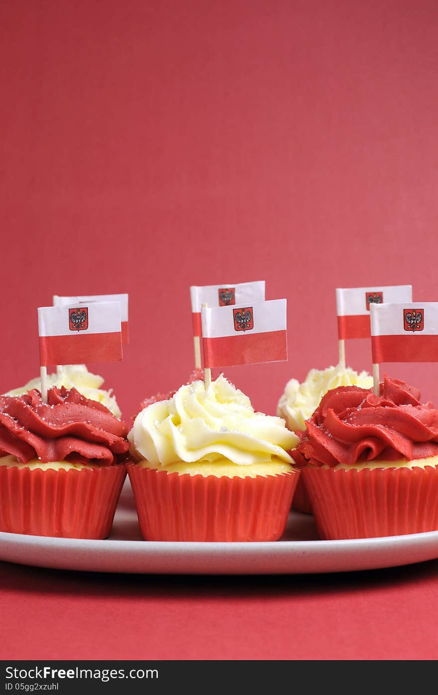 Polish red and white decorated cupcakes with Poland flags for November 11, National Independence Day celebrations or national holiday party. Polish red and white decorated cupcakes with Poland flags for November 11, National Independence Day celebrations or national holiday party.