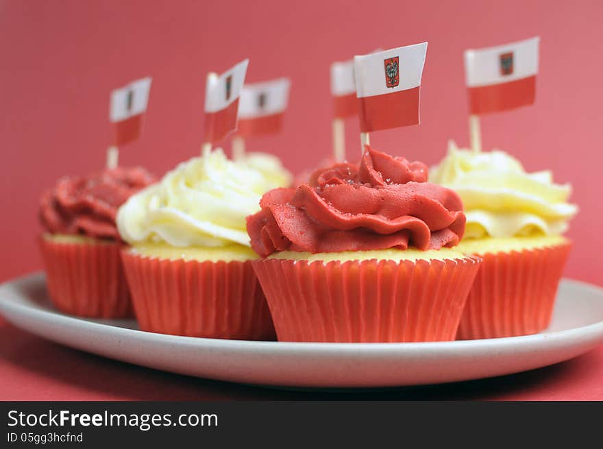 Polish red and white decorated cupcakes with Poland flags for November 11, National Independence Day celebrations or national holiday party. Polish red and white decorated cupcakes with Poland flags for November 11, National Independence Day celebrations or national holiday party.