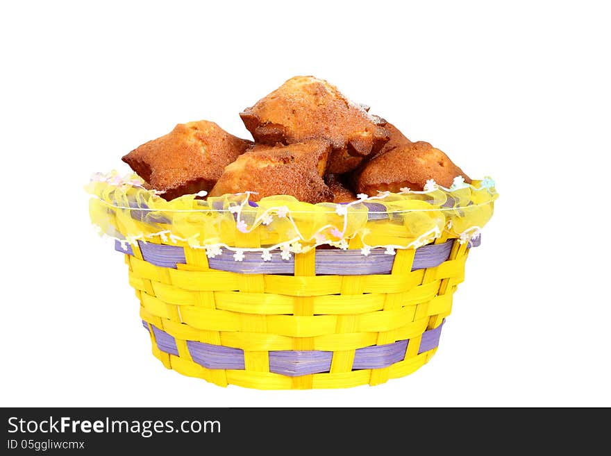 Basket with cupcakes on a white background