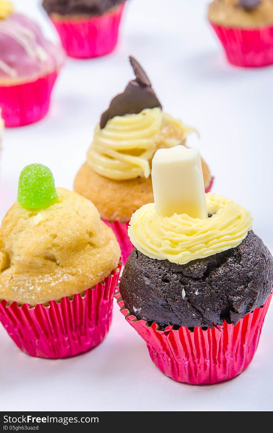 Assorted colorful and decorated cupcakes