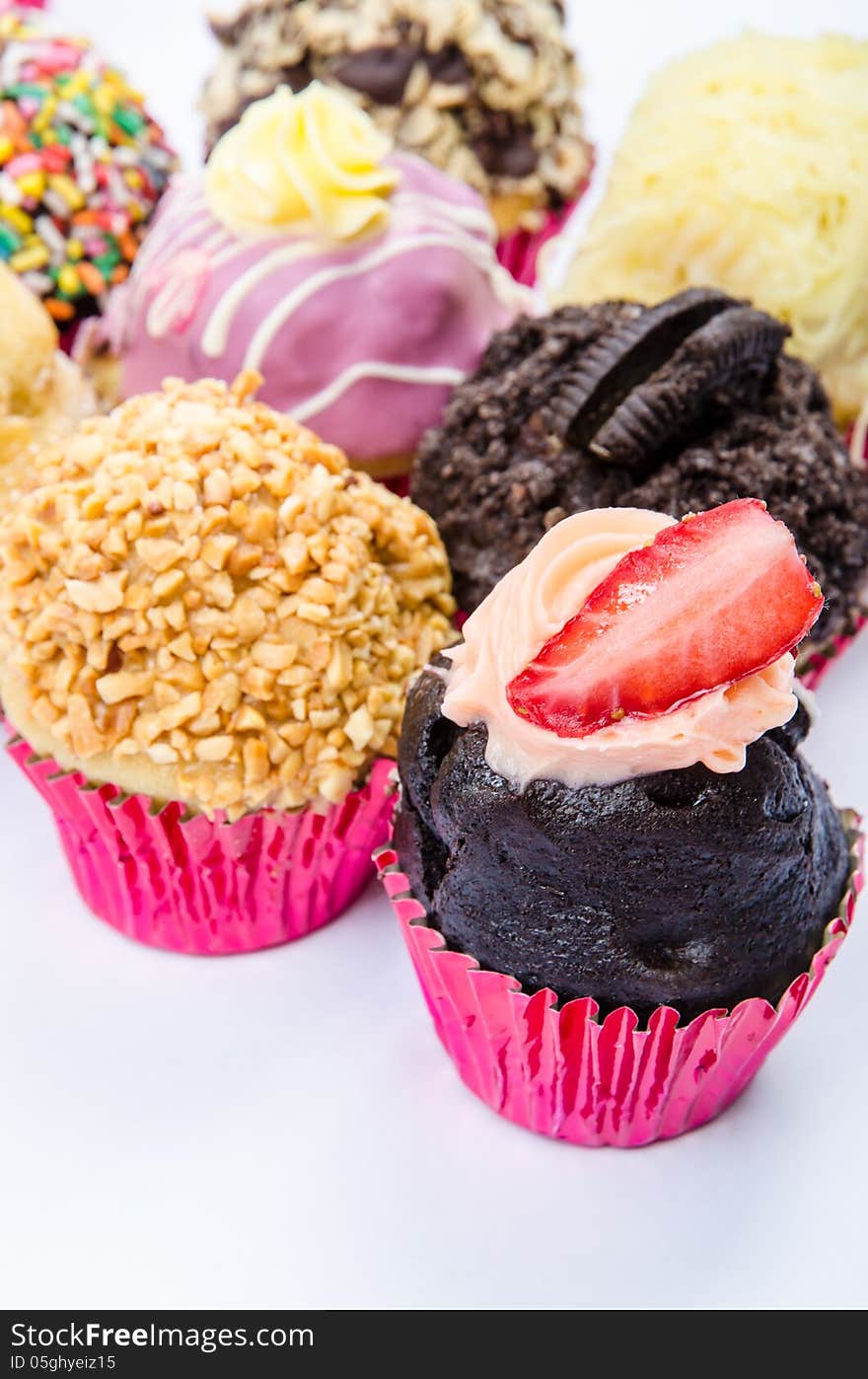 Assorted colorful and decorated cupcakes