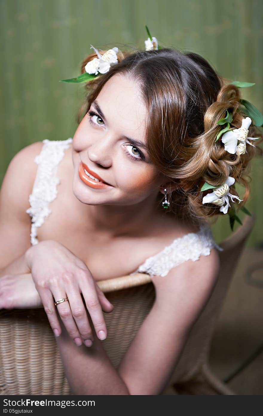 Portrait beautiful bride with flowers in hair. Portrait beautiful bride with flowers in hair