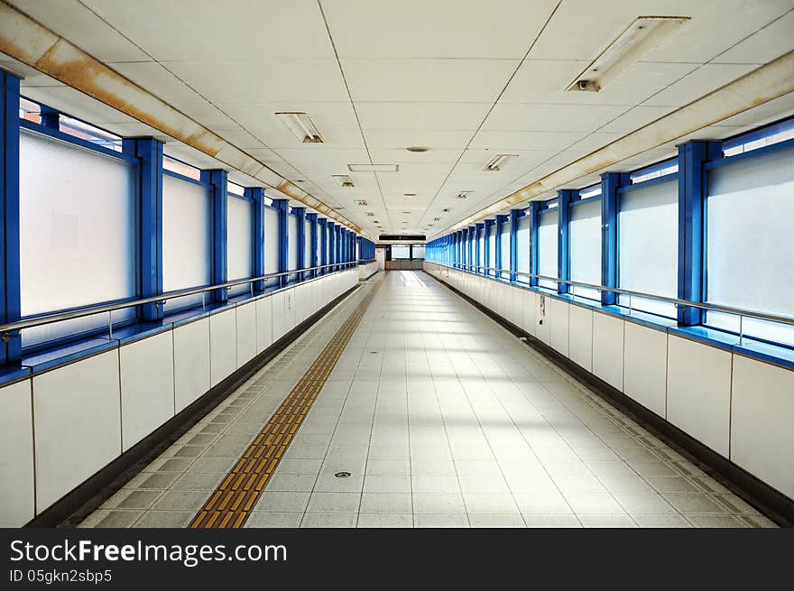 Empty long corridor in the modern office building.