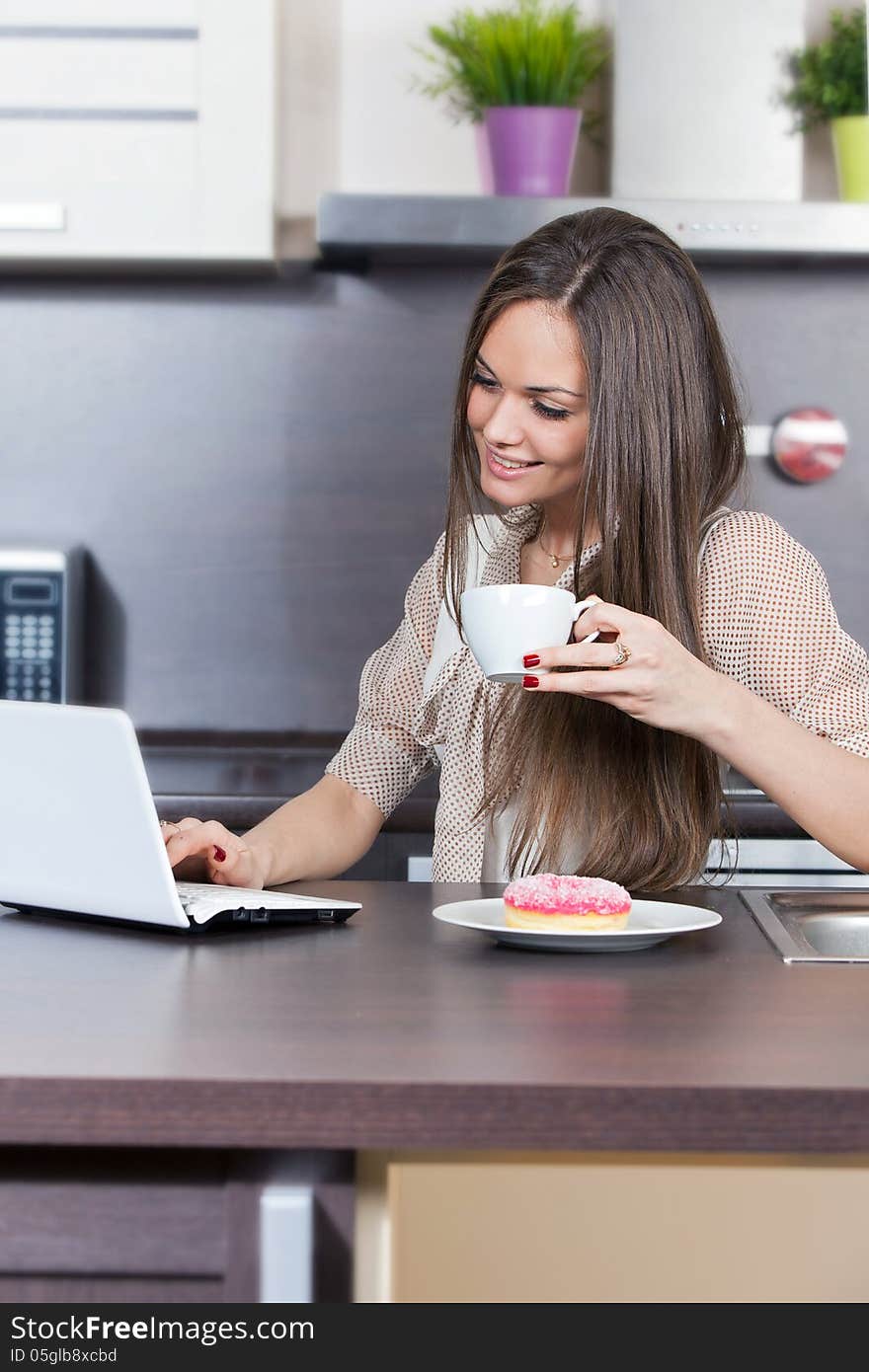 Young woman at home in the kitchen