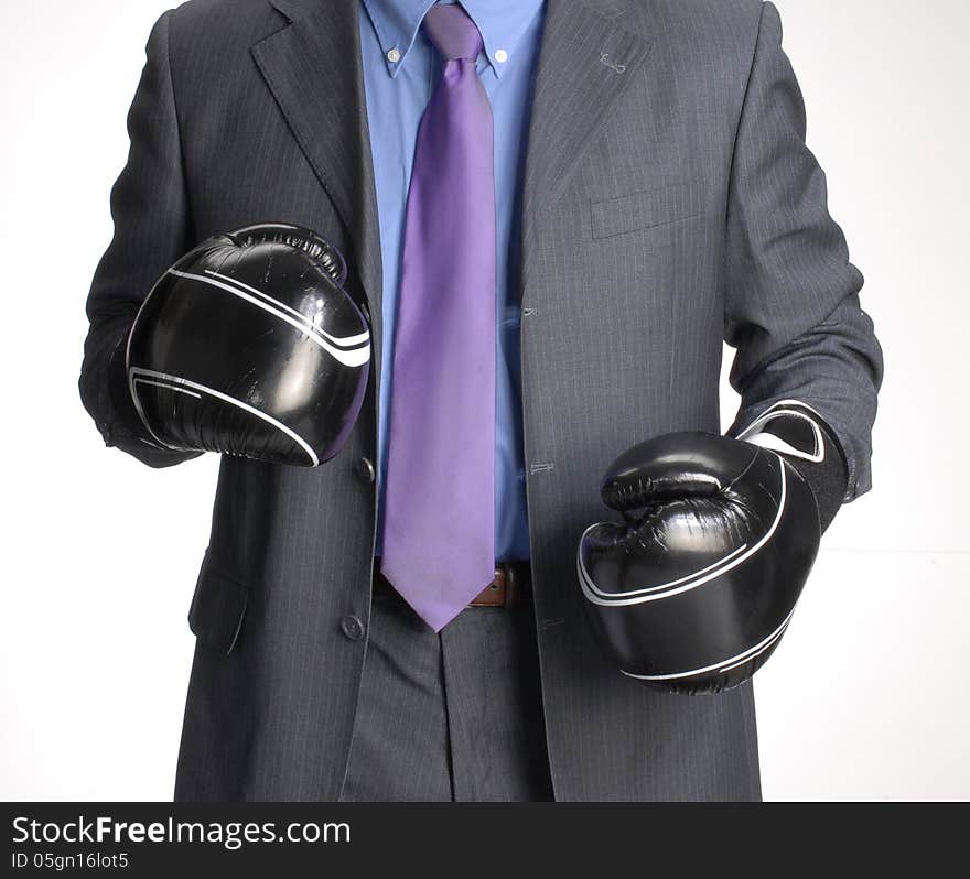 Businessman with a boxing gloves. Businessman with a boxing gloves