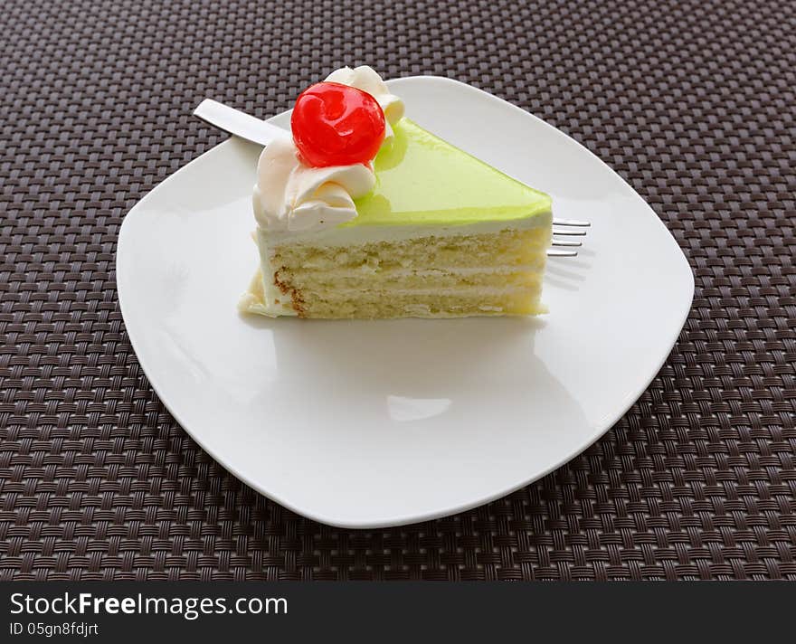 Vanilla cake slice with fresh cherry. Vanilla cake slice with fresh cherry