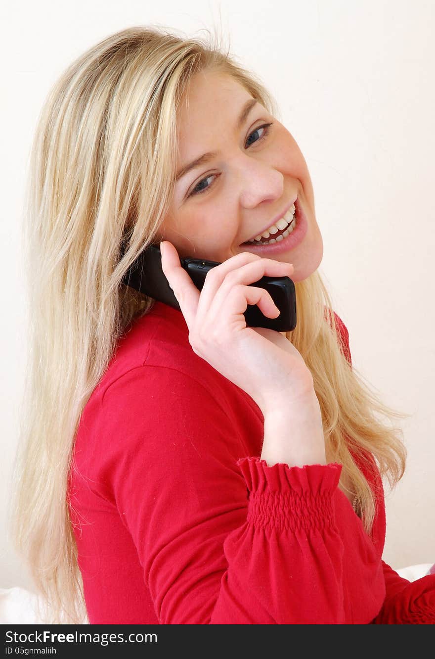 Young woman talking on the phone. Young woman talking on the phone