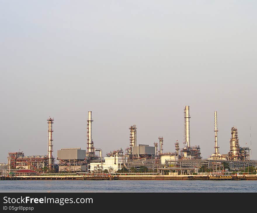 Group of refinery tower in cloudy day and sunlight. Group of refinery tower in cloudy day and sunlight