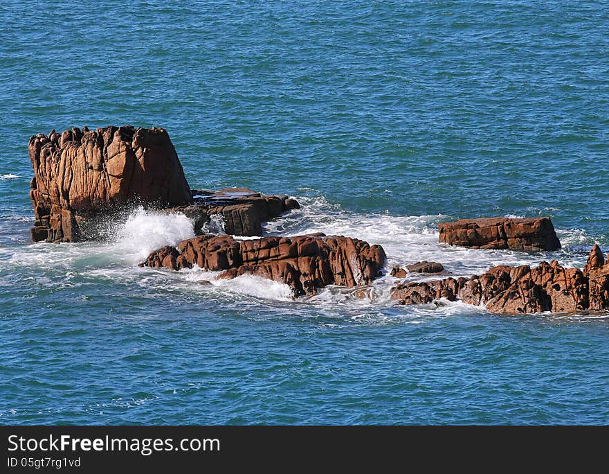 Coastal scene in Guernsey with  rocks