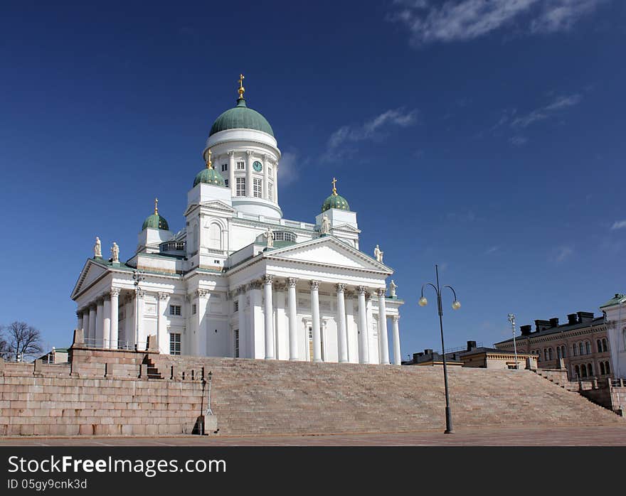 Finnish Evangelical Lutheran Cathedral of the Diocese of Helsinki against deep blue sky. Finnish Evangelical Lutheran Cathedral of the Diocese of Helsinki against deep blue sky.