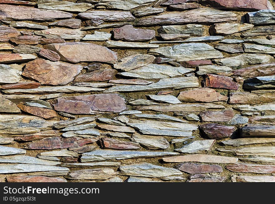 A stone wall background.