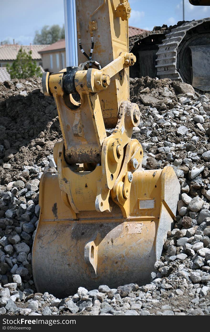 This is a hydraulic excavator with a 2 cubic yard bucket attached, digging in loose soil and rock. This is a hydraulic excavator with a 2 cubic yard bucket attached, digging in loose soil and rock.