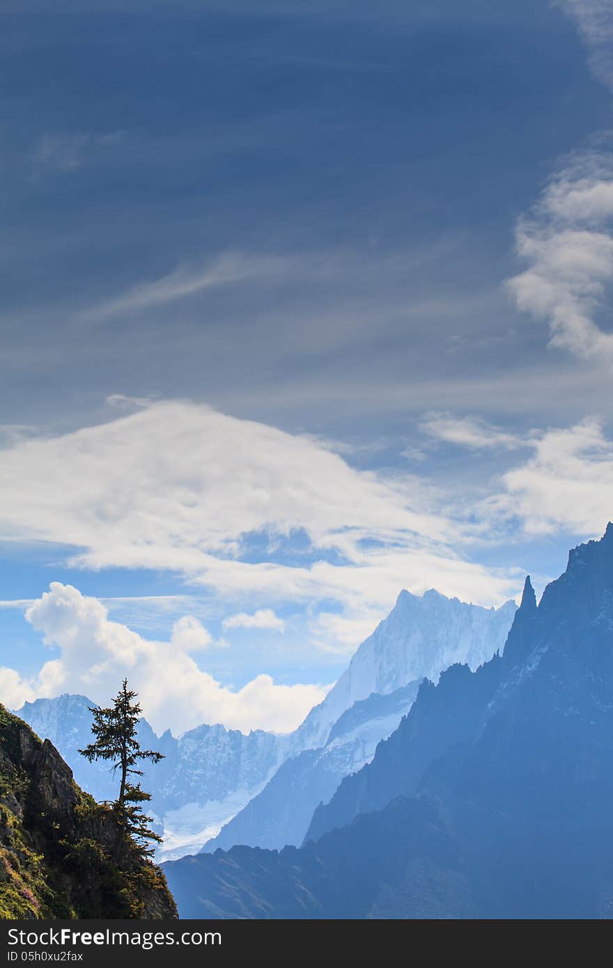 Snow Covered Mountains And Rocky Peaks In The French Alps