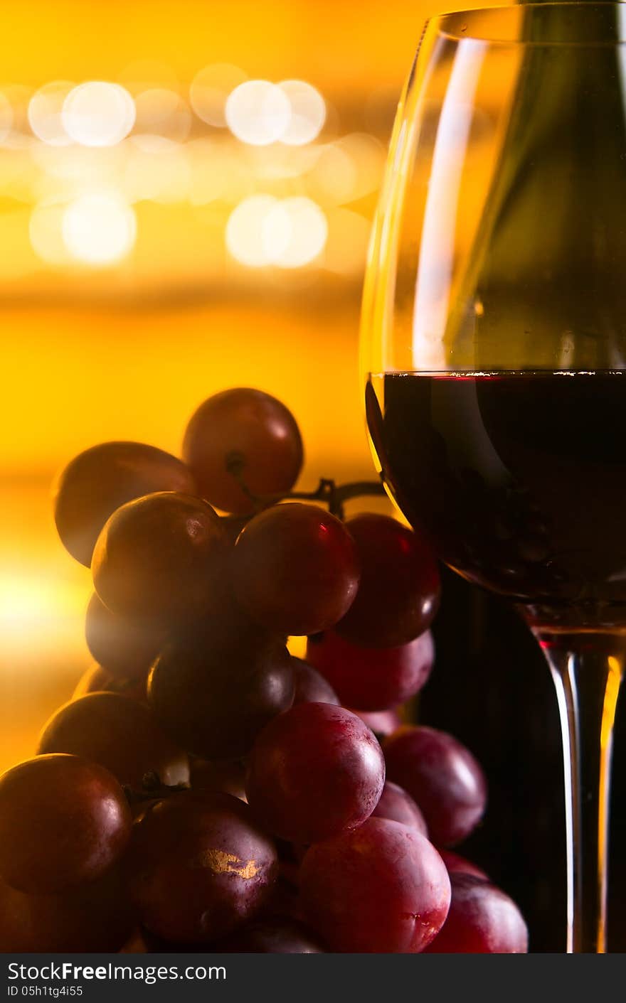 Grape and glass with red wine