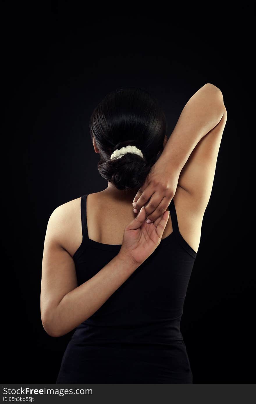 Indian Female In Black Dress Touches Their Hands