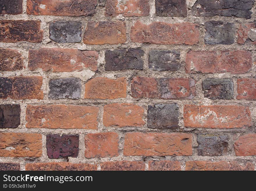 Photo shows a fragment of the old wall made â€‹â€‹of bricks. Photo shows a fragment of the old wall made â€‹â€‹of bricks.