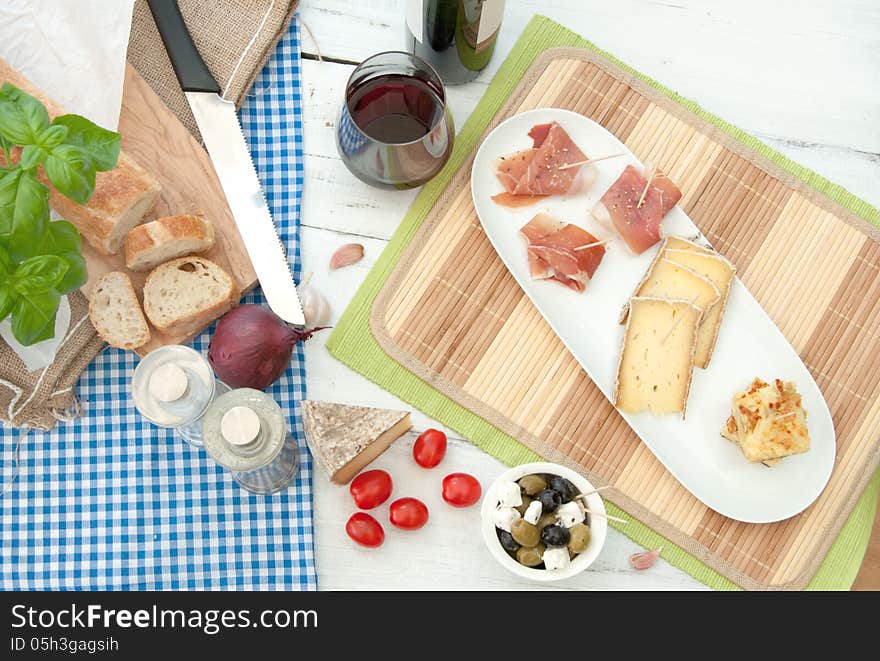 Platter consisting of potato omelette, cheese and serrano ham. Platter consisting of potato omelette, cheese and serrano ham