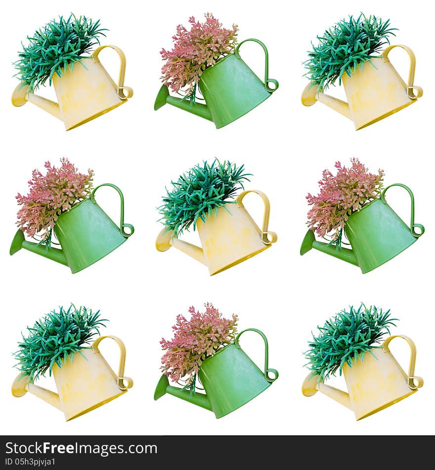 Beautiful plant in watering can decorate tile background isolated