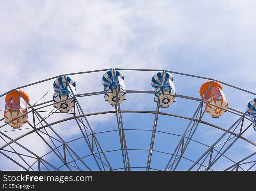 Part of ferris wheel with sky