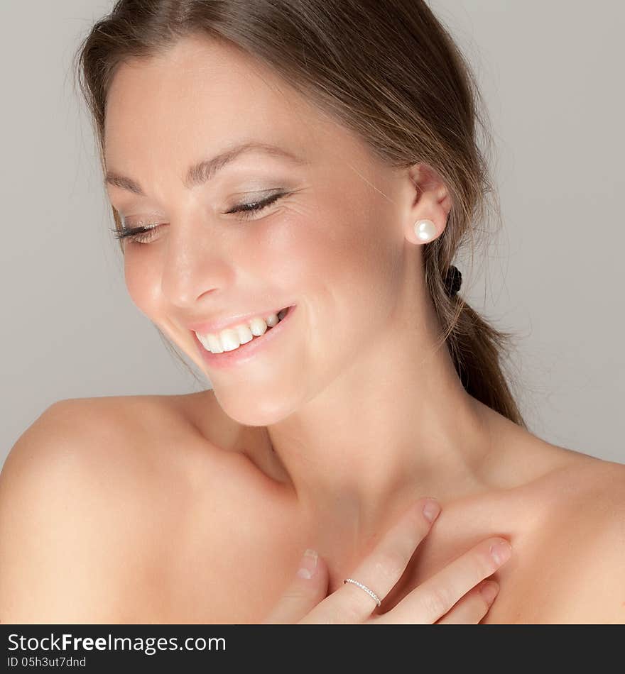 A portrait of a happy woman smiling prettily. A portrait of a happy woman smiling prettily